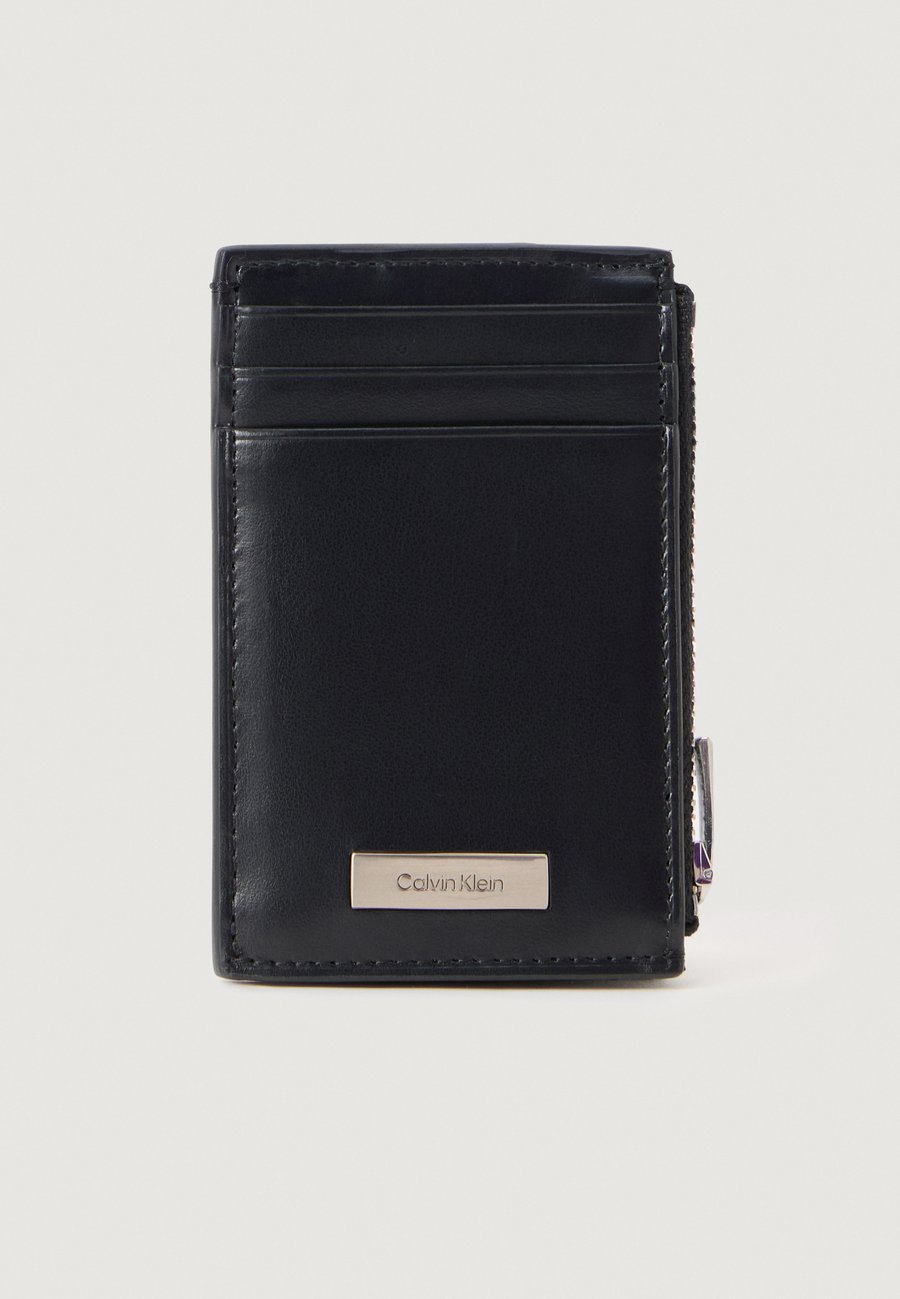 Кошелек Calvin Klein PLAQUE ZIP CARD CASE, Black
Кошелек Calvin Klein PLAQUE ZIP CARD CASE, Black