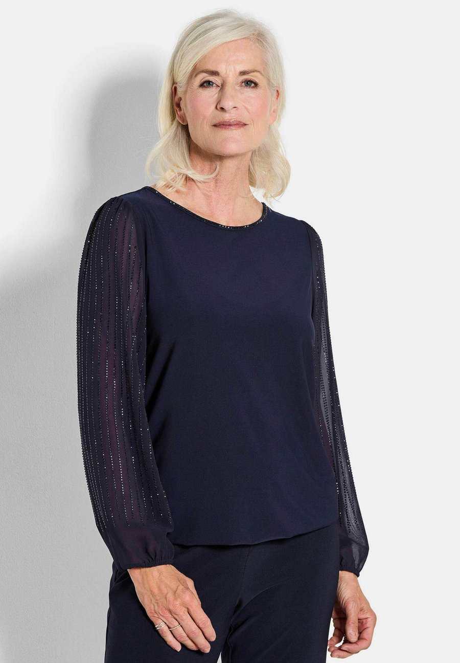 Блуза GOLDNER MIT GLITZERNDEN ÄRMELN, Navy/Blue
Блуза GOLDNER MIT GLITZERNDEN ÄRMELN, Navy/Blue