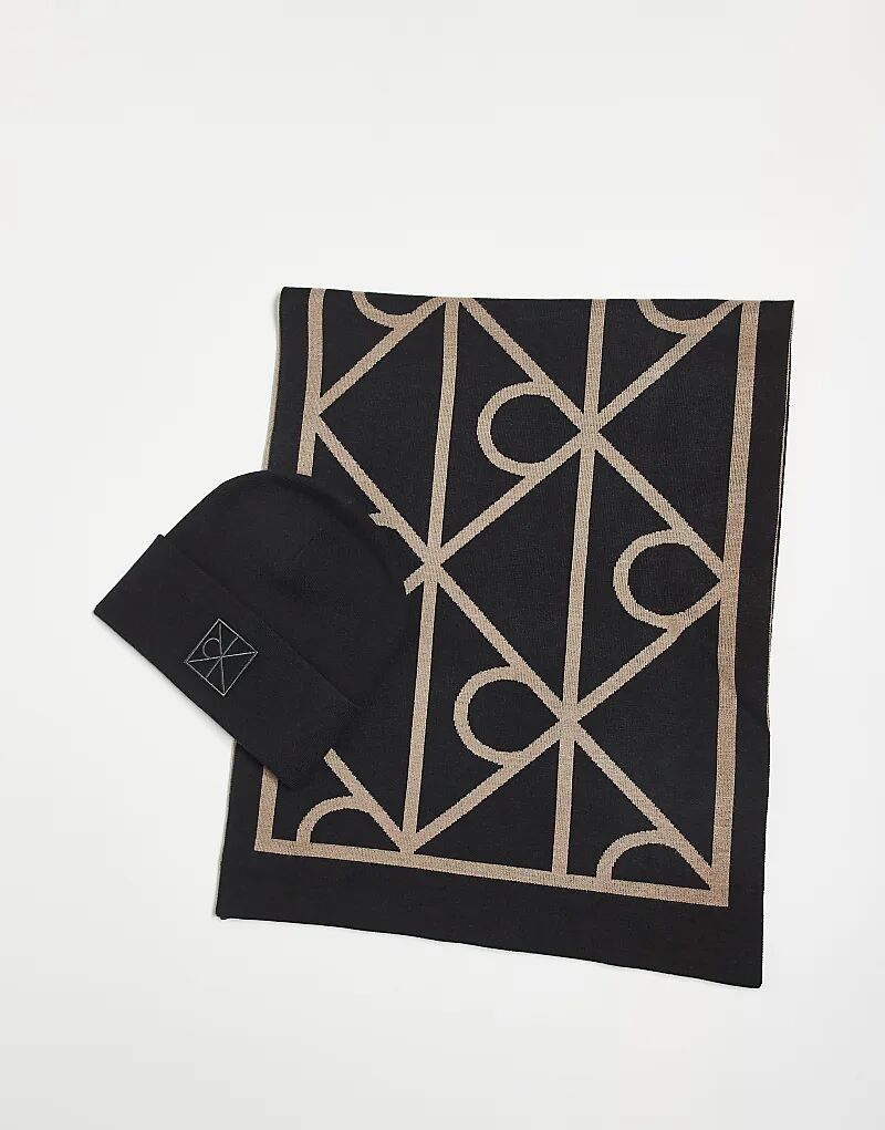 Подарочный набор из шапки и шарфа с монограммой Calvin Klein Jeans черного цвета
Подарочный набор из шапки и шарфа с монограммой Calvin Klein Jeans черного цвета