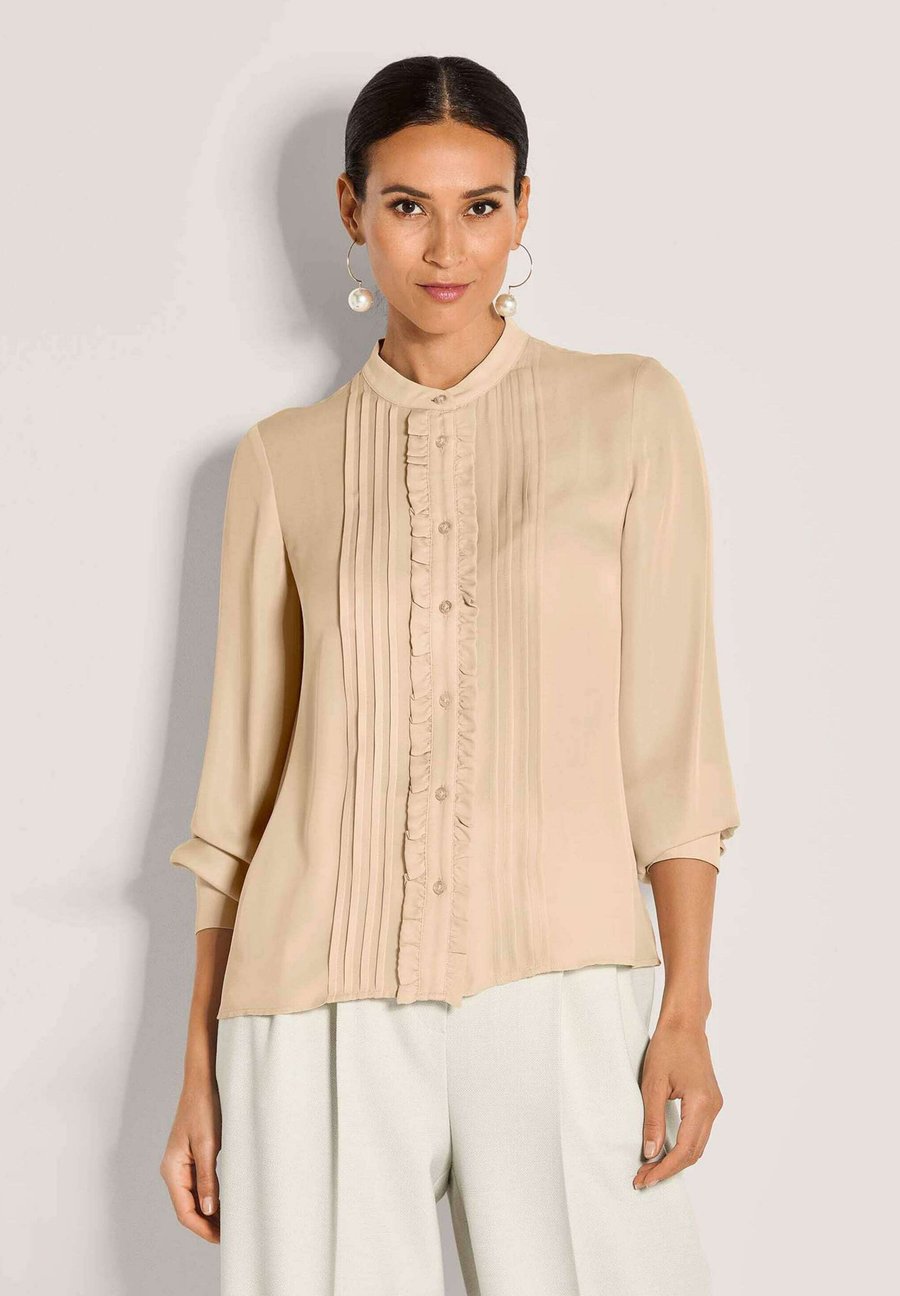 Блуза MADELEINE Button-down blouse, Beige
Блуза MADELEINE Button-down blouse, Beige