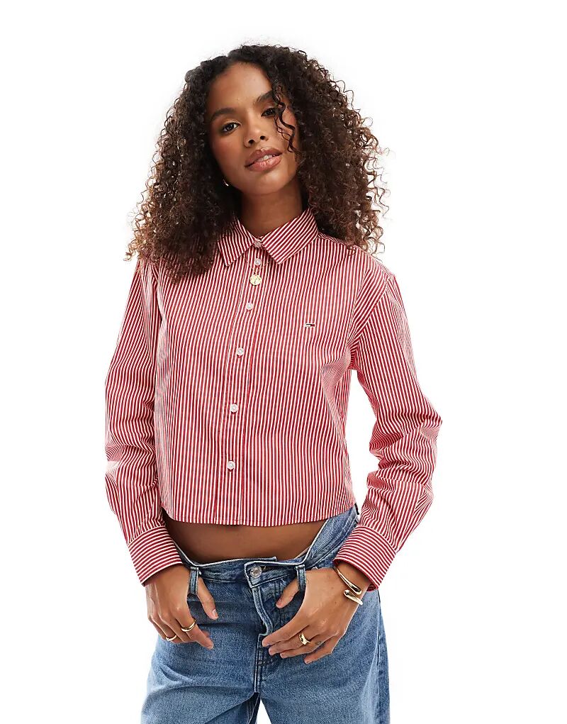 Укороченная поплиновая полосатая рубашка красного и белого цвета Tommy Jeans
Укороченная поплиновая полосатая рубашка красного и белого цвета Tommy Jeans