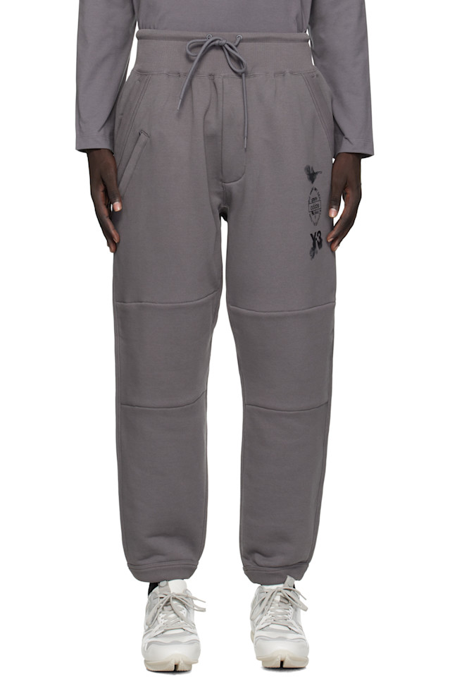 Y-3 Серые спортивные брюки с отворотами
Y-3 Серые спортивные брюки с отворотами
