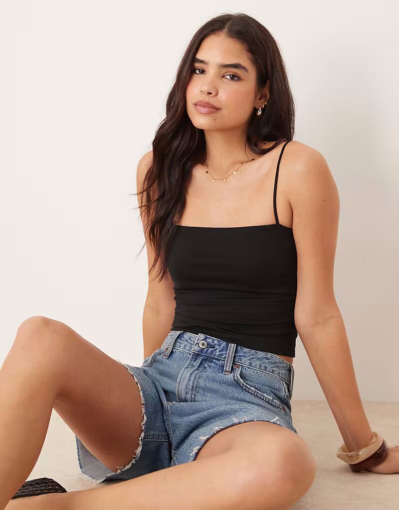 Gina Tricot трикотажный топ с бретельками черного цвета
Gina Tricot трикотажный топ с бретельками черного цвета