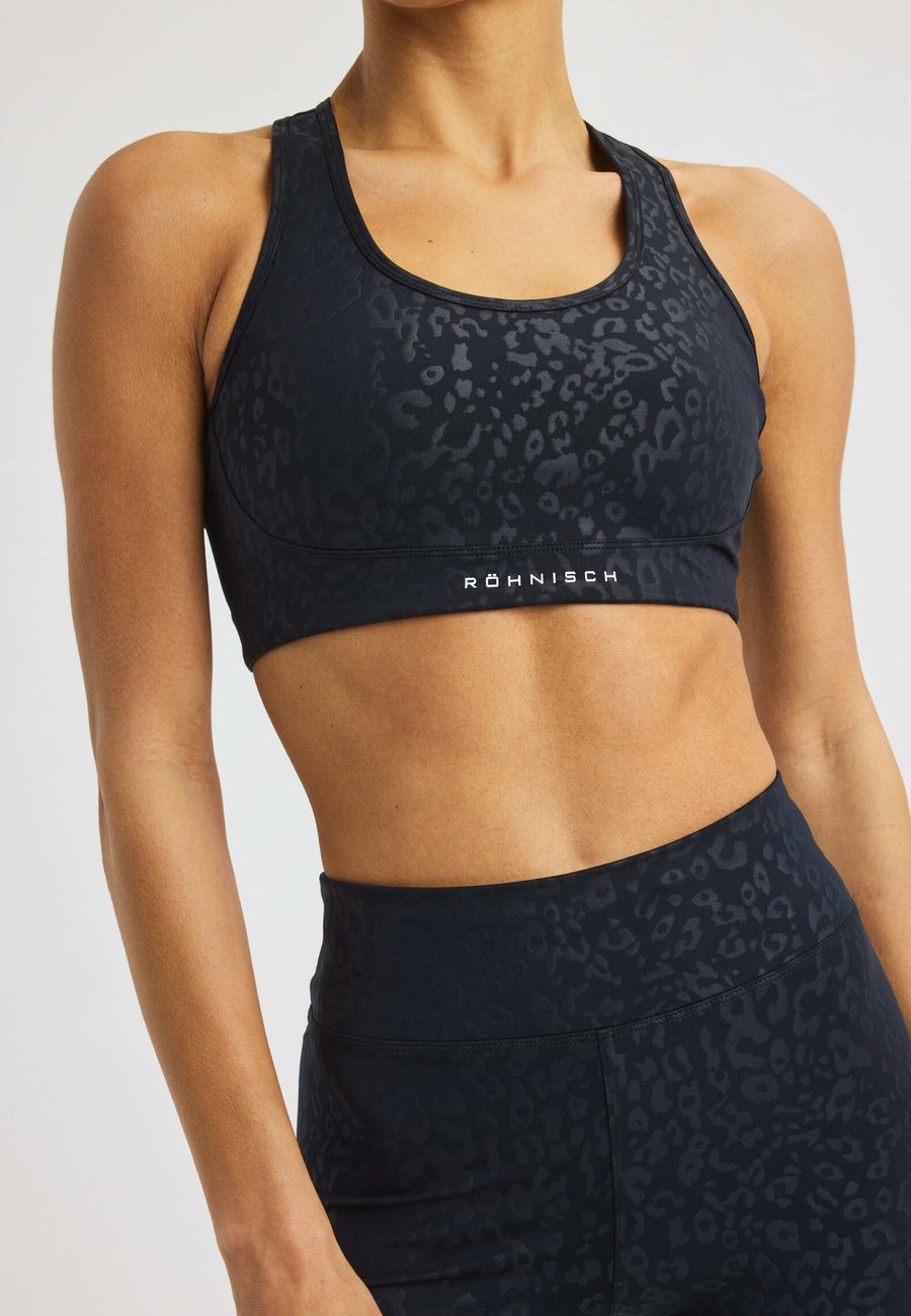 Бюстгальтер Röhnisch FLATTERING, Leo Emboss Black/Dark Grey
Бюстгальтер Röhnisch FLATTERING, Leo Emboss Black/Dark Grey
