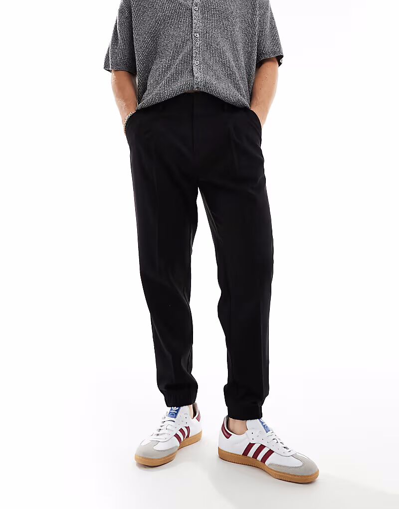 Зауженные элегантные брюки с манжетами в стиле джоггеров черного цвета Asos Design
Зауженные элегантные брюки с манжетами в стиле джоггеров черного цвета Asos Design