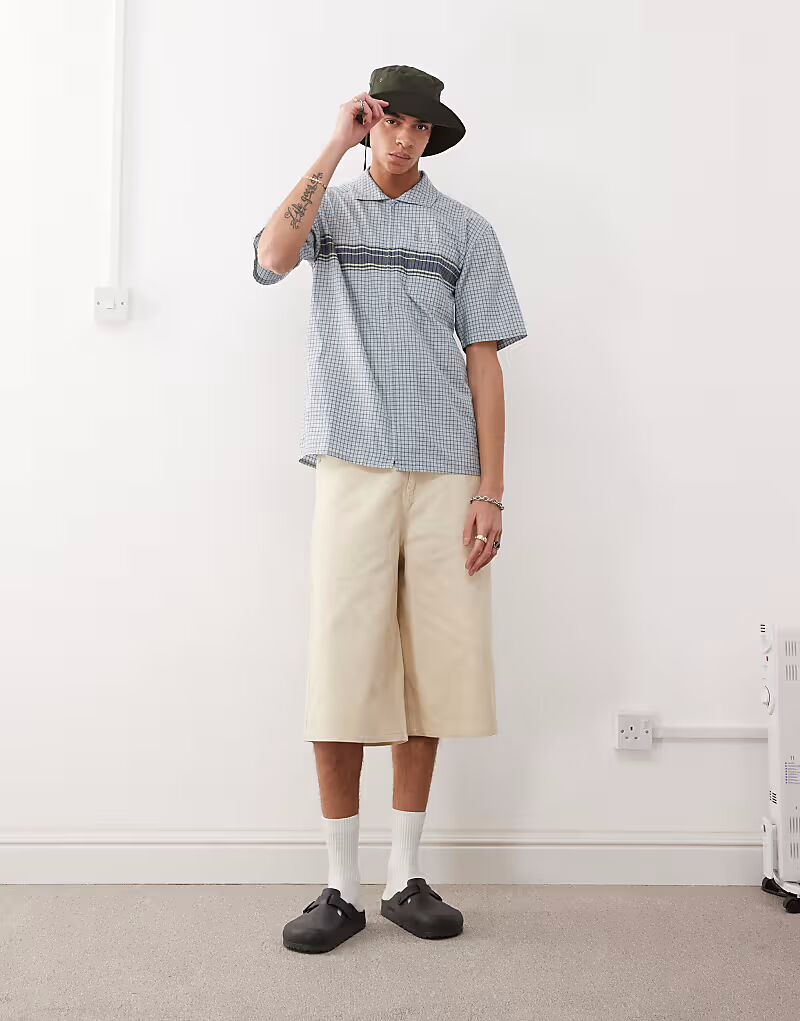 Рубашка Gramicci с застежкой-молнией и волнистым узором синего цвета
Рубашка Gramicci с застежкой-молнией и волнистым узором синего цвета