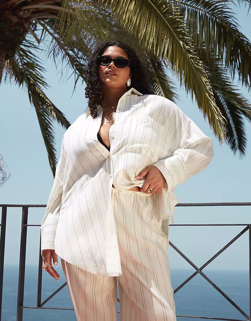 Пляжная рубашка-плащница Curve Belle с завязками по бокам в однотонную полоску от ASOS DESIGN ASOS Curve
Пляжная рубашка-плащница Curve Belle с завязками по бокам в однотонную полоску от ASOS DESIGN ASOS Curve