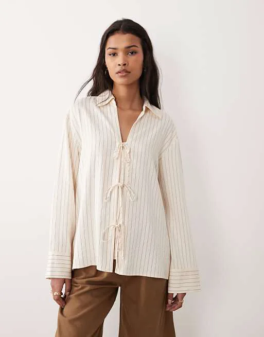 Кремовая рубашка с завязкой спереди Nothing's Child Binky
Кремовая рубашка с завязкой спереди Nothing's Child Binky