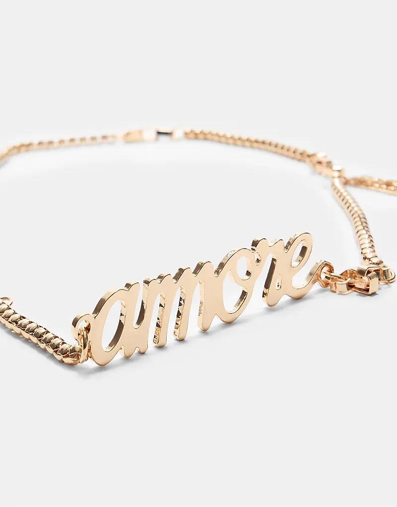 Металлический ремень Stradivarius Amore в золоте
Металлический ремень Stradivarius Amore в золоте