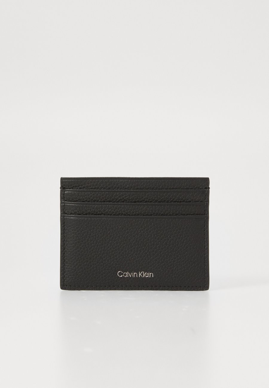 Кошелек Calvin Klein FOIL EMBOSS CARD CASE, Black
Кошелек Calvin Klein FOIL EMBOSS CARD CASE, Black