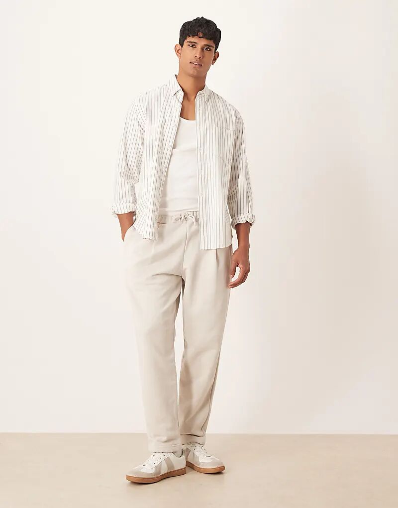 Свободные зауженные брюки-джоггеры ASOS DESIGN со складками цвета камня
Свободные зауженные брюки-джоггеры ASOS DESIGN со складками цвета камня