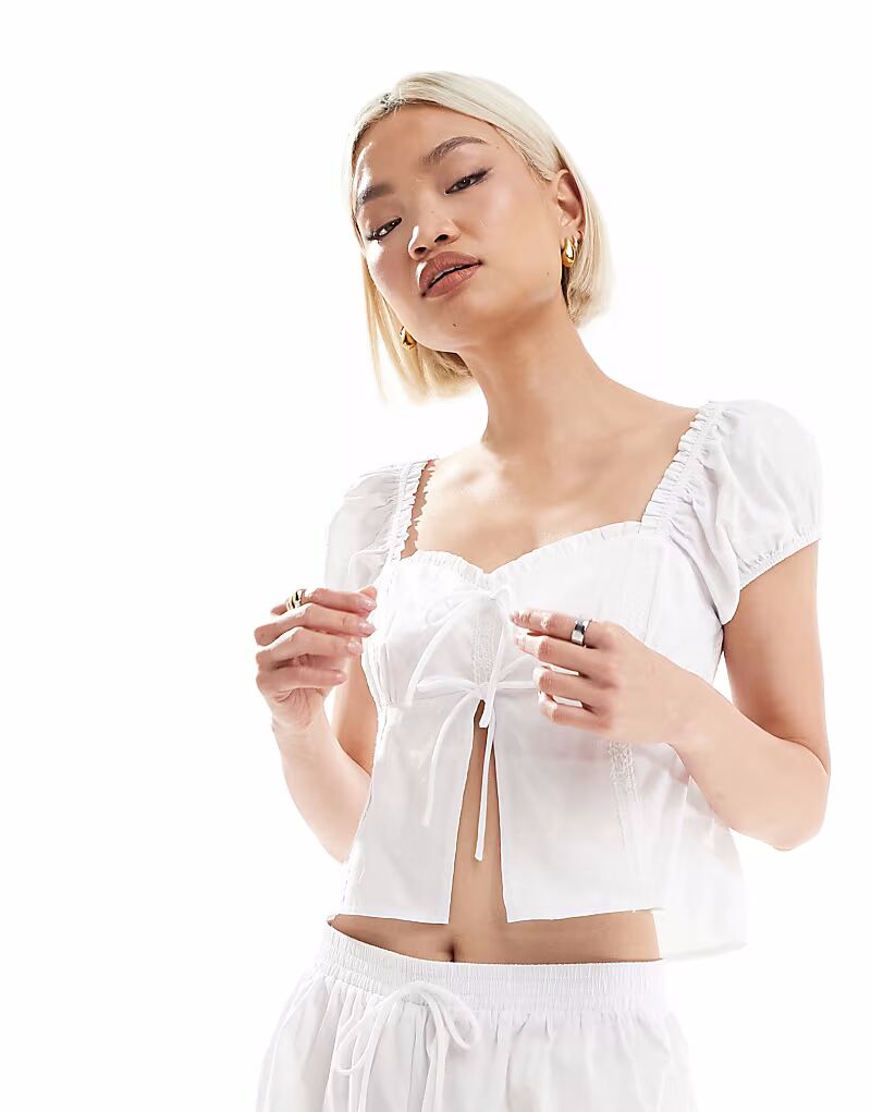 Эксклюзивный пижамный топ Frolic Milkmaid из хлопка с завязкой спереди, белый цвет The Frolic
Эксклюзивный пижамный топ Frolic Milkmaid из хлопка с завязкой спереди, белый цвет The Frolic