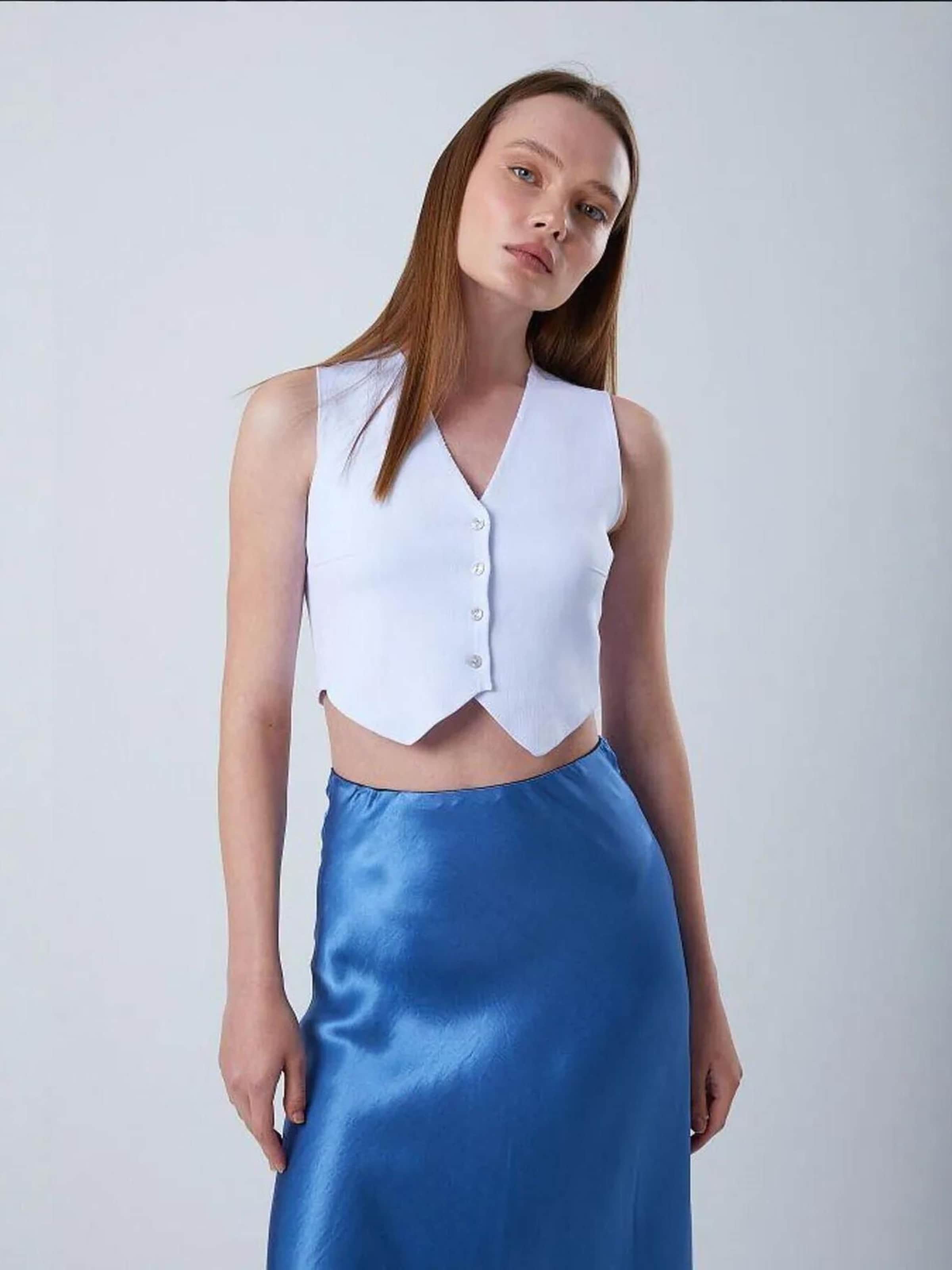 MixRay Вязаный жилет в пастельно-голубом цвете
MixRay Вязаный жилет в пастельно-голубом цвете