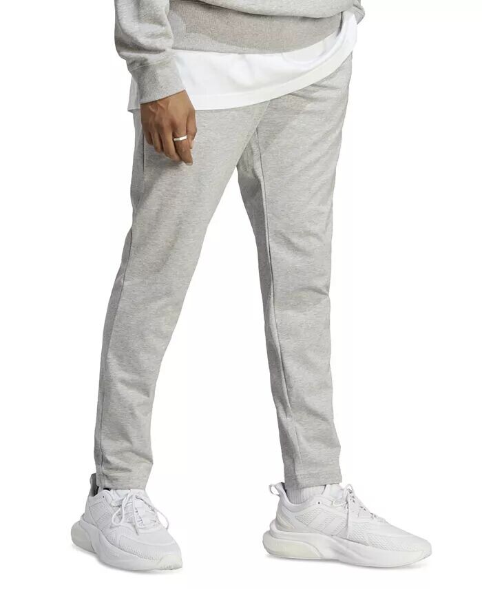 Мужские спортивные брюки Essentials Performance Single Jersey с зауженным кроем и открытым краем adidas, серый
Мужские спортивные брюки Essentials Performance Single Jersey с зауженным кроем и открытым краем adidas, серый