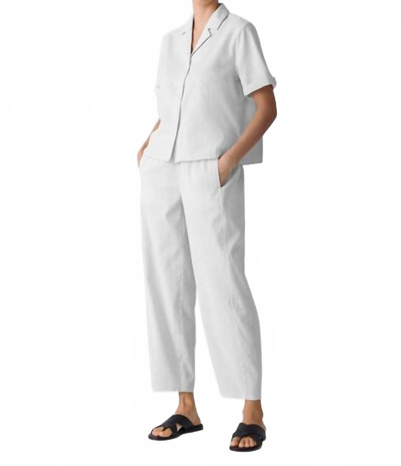 Белая рубашка с черным вырезом воротника Eileen Fisher
Белая рубашка с черным вырезом воротника Eileen Fisher