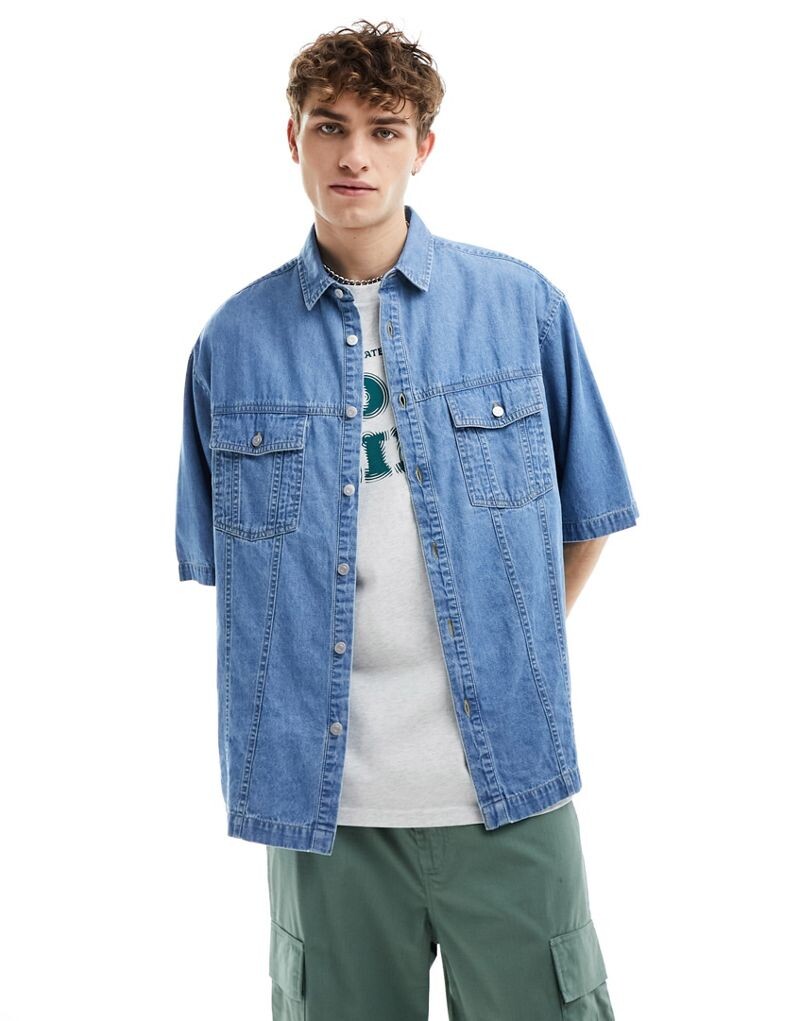 Джинсовая рубашка оверсайз с короткими рукавами ASOS DESIGN синего цвета с эффектом потертости
Джинсовая рубашка оверсайз с короткими рукавами ASOS DESIGN синего цвета с эффектом потертости