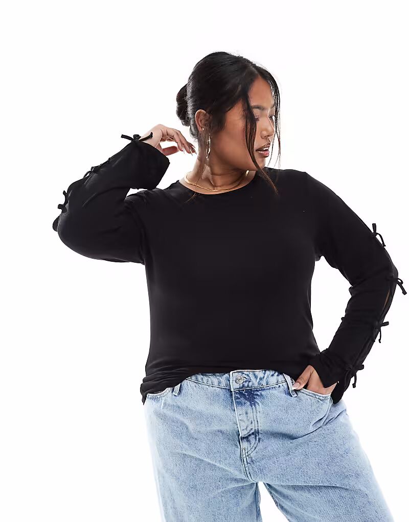 ТОлько черный топ с длинными рукавами и бантом
ТОлько черный топ с длинными рукавами и бантом