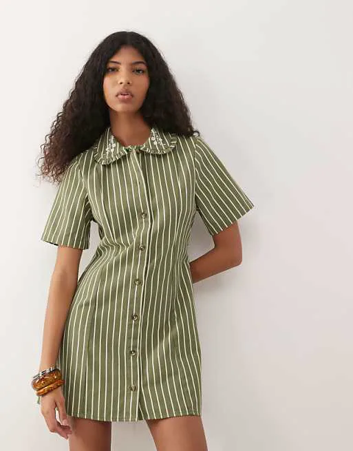 Джинсовое платье-рубашка в зелено-бежевую полоску с вышитым воротником Reclaimed Vintage
Джинсовое платье-рубашка в зелено-бежевую полоску с вышитым воротником Reclaimed Vintage