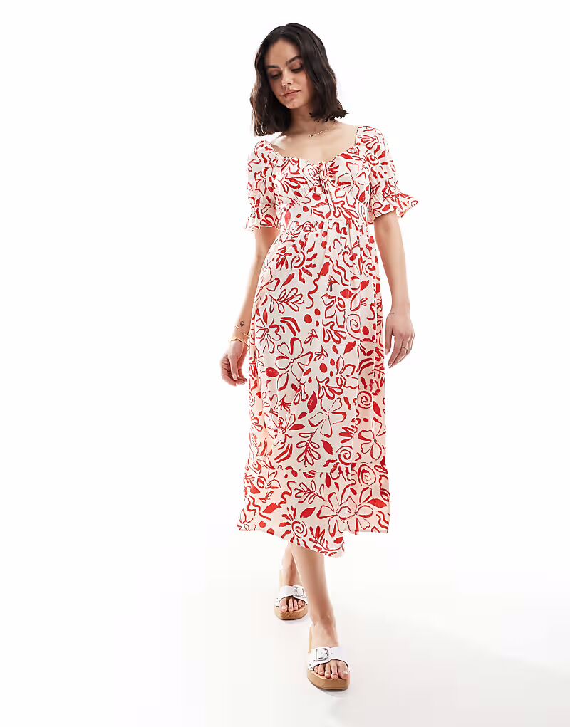 Платье-миди «Доярка» с цветочным принтом и рукавами-фонариками от Wednesday's Girl в красном и кремовом цветах
Платье-миди «Доярка» с цветочным принтом и рукавами-фонариками от Wednesday's Girl в красном и кремовом цветах