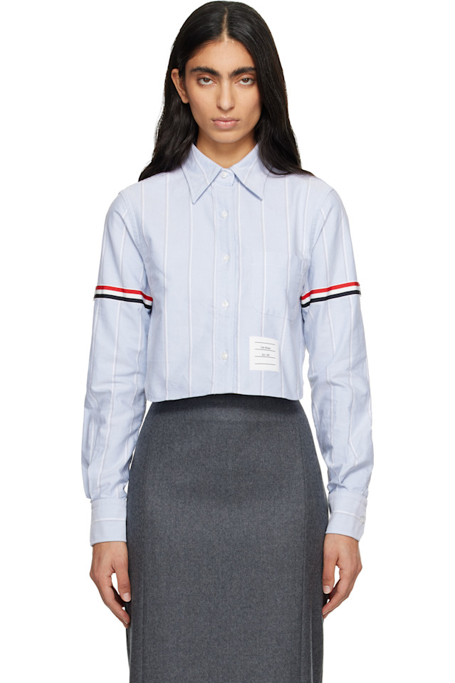 Thom Browne Синяя рубашка-оксфорд с нарукавной повязкой и укороченным круглым воротником
Thom Browne Синяя рубашка-оксфорд с нарукавной повязкой и укороченным круглым воротником