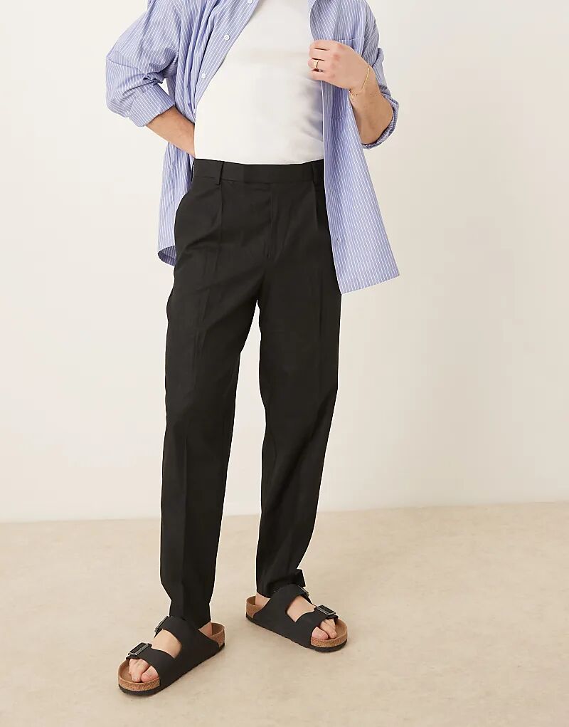 Свободные зауженные брюки из льняной смеси ASOS DESIGN черного цвета со складкой спереди
Свободные зауженные брюки из льняной смеси ASOS DESIGN черного цвета со складкой спереди