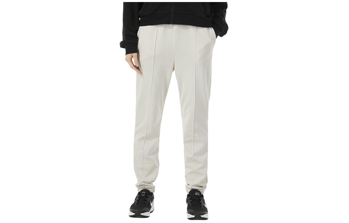 Трикотажные спортивные штаны женские бежевые Nike 
Трикотажные спортивные штаны женские бежевые Nike