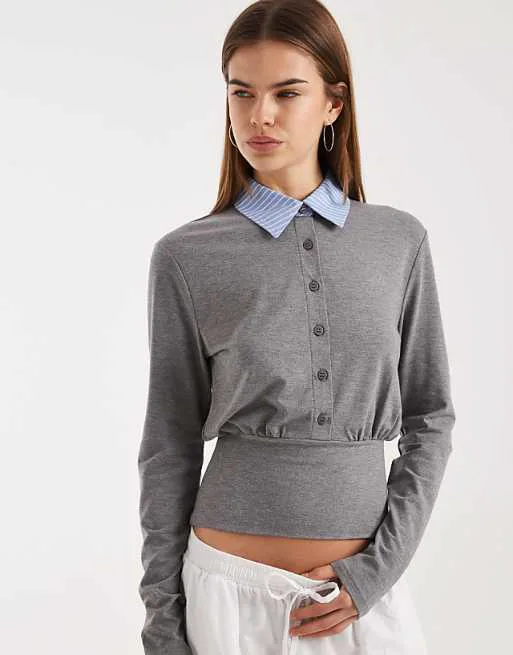 Темно-серый топ из контрастного поплина с воротником на пуговицах и застежкой на талии ASOS DESIGN
Темно-серый топ из контрастного поплина с воротником на пуговицах и застежкой на талии ASOS DESIGN