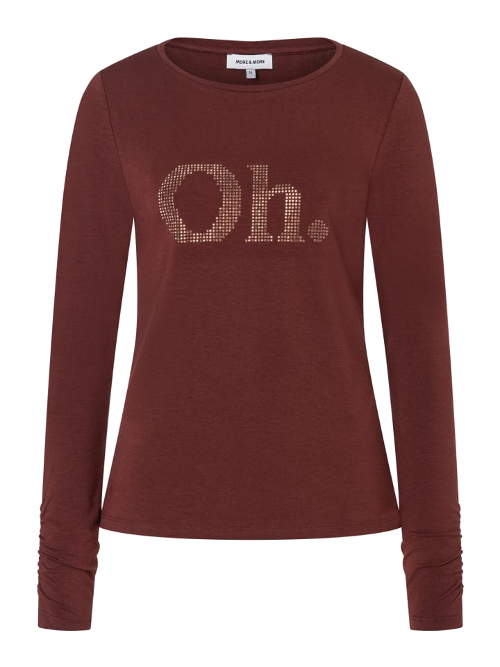 Мягкая рубашка с длинными рукавами и надписью из стразов в изюмно-коричневом цвете. More & More
Мягкая рубашка с длинными рукавами и надписью из стразов в изюмно-коричневом цвете. More & More