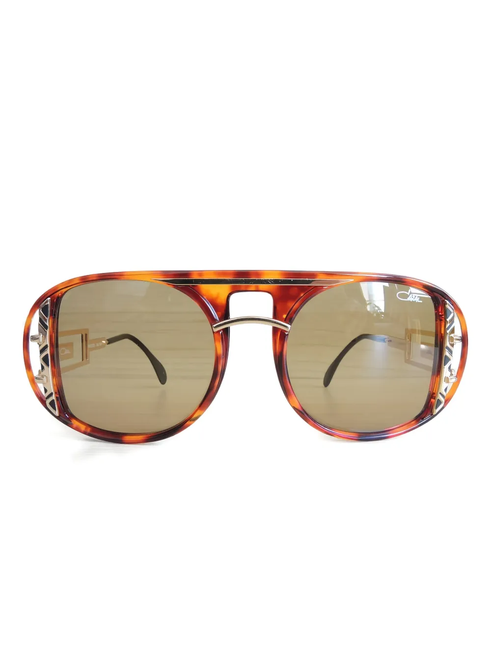 Солнцезащитные очки с геометрической оправой Cazal, коричневый
Солнцезащитные очки с геометрической оправой Cazal, коричневый