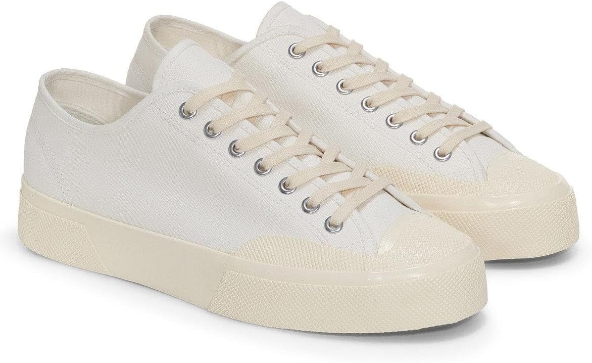 Унисекс низкие кеды из канвы бежево-слоновой кости от SUPERGA IT
Унисекс низкие кеды из канвы бежево-слоновой кости от SUPERGA IT