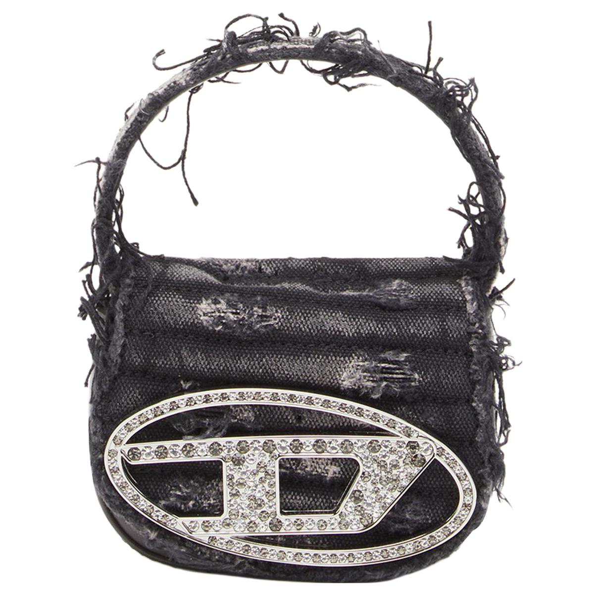 Сумка через плечо мини женская черная DIESEL из кожи коровы с тканью
Сумка через плечо мини женская черная DIESEL из кожи коровы с тканью