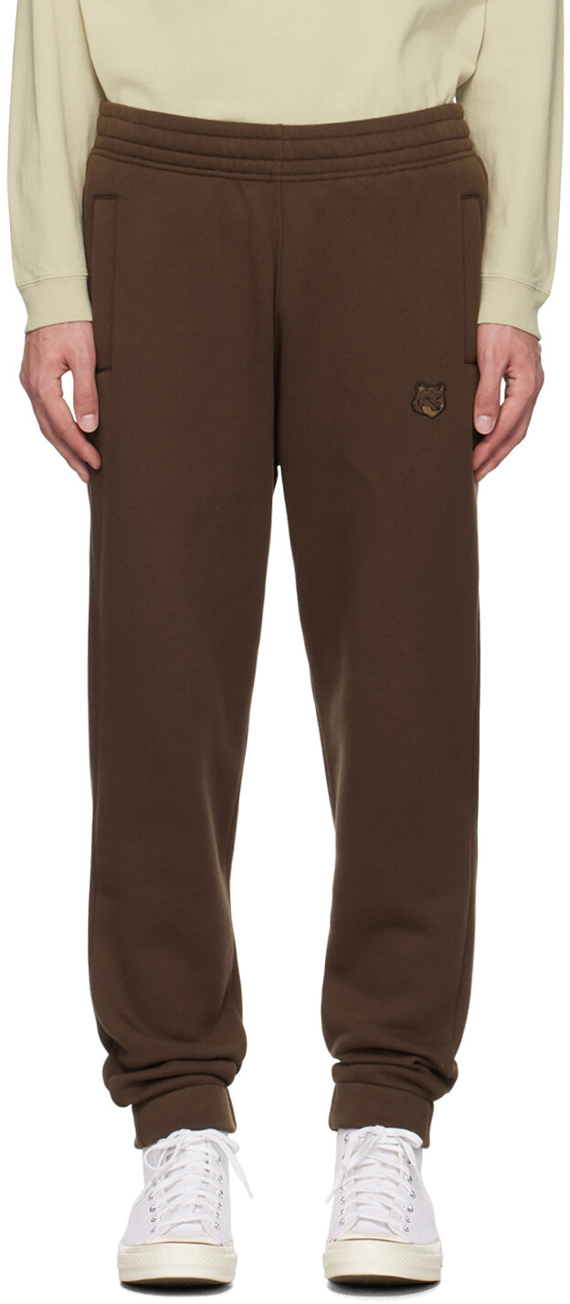 Спортивные штаны с яркой коричневой нашивкой в виде головы лисы Maison Kitsune
Спортивные штаны с яркой коричневой нашивкой в виде головы лисы Maison Kitsune