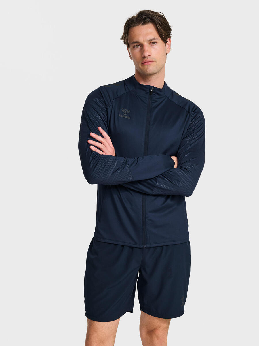 Куртка на молнии с отверстиями для больших пальцев Hmlpro Adult HUMMEL
Куртка на молнии с отверстиями для больших пальцев Hmlpro Adult HUMMEL