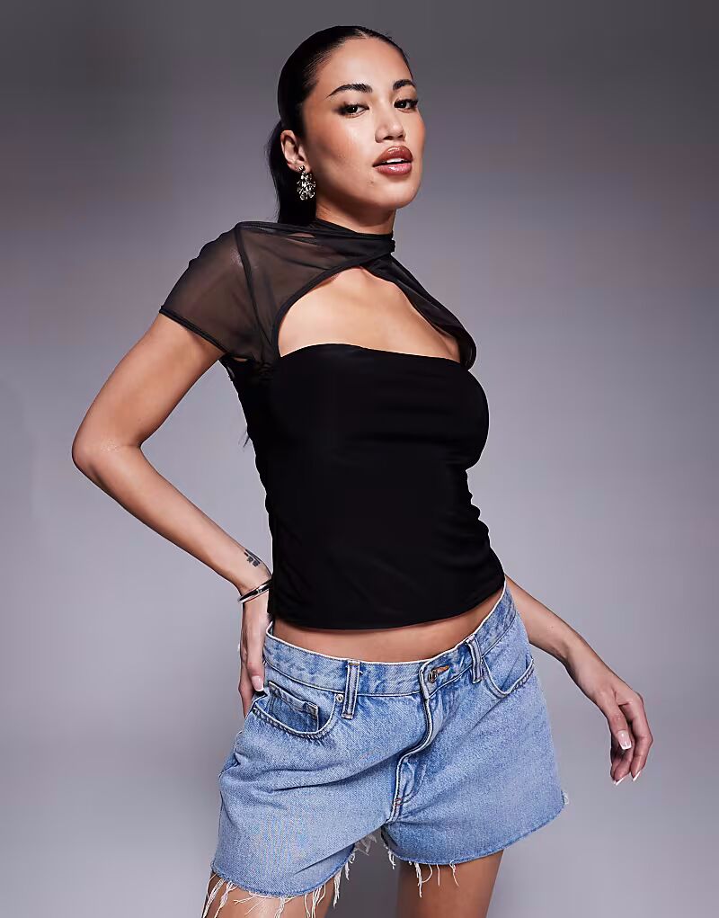 Топ из сетчатой ткани ASOS DESIGN с короткими рукавами, перекрестным воротником и круглыми пуговицами черного цвета
Топ из сетчатой ткани ASOS DESIGN с короткими рукавами, перекрестным воротником и круглыми пуговицами черного цвета