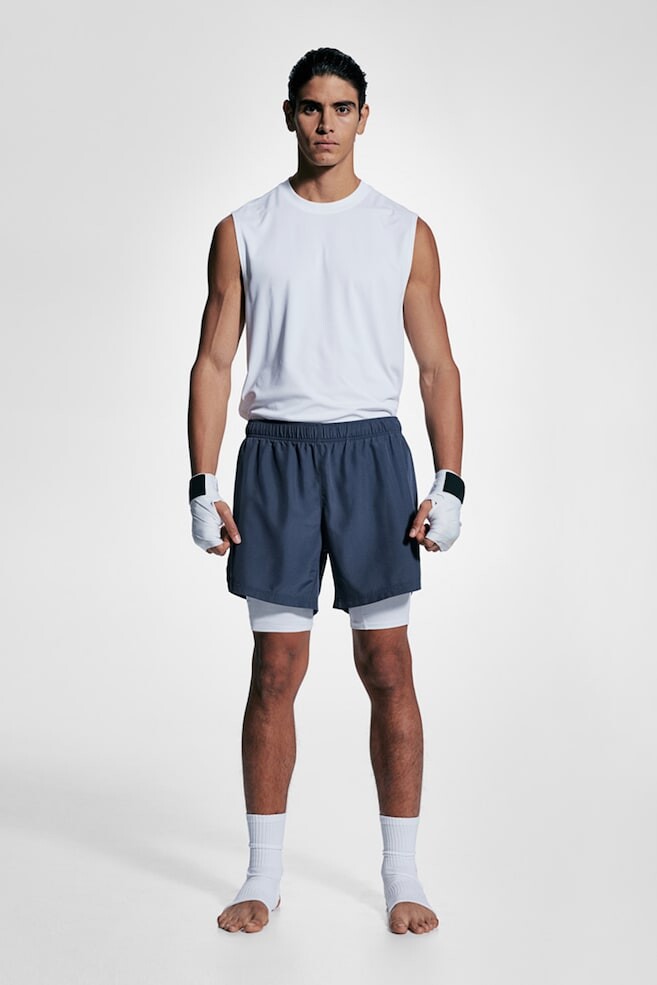 Двухслойные спортивные шорты из драймува H&M, синий
Двухслойные спортивные шорты из драймува H&M, синий