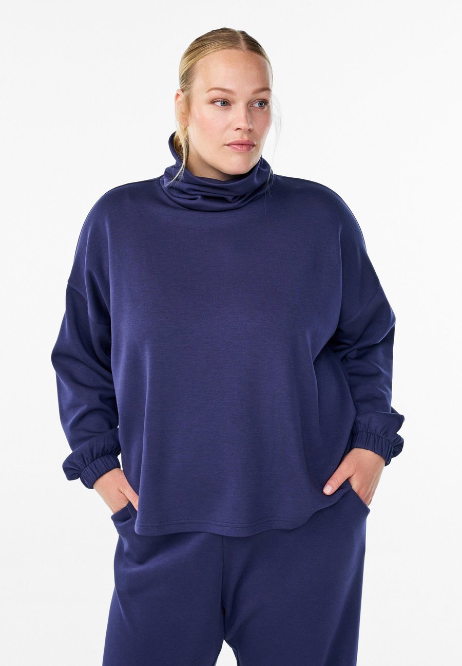 Блуза Zizzi MIT ROLLKRAGEN , Evening Blue/Dark Blue
Блуза Zizzi MIT ROLLKRAGEN , Evening Blue/Dark Blue