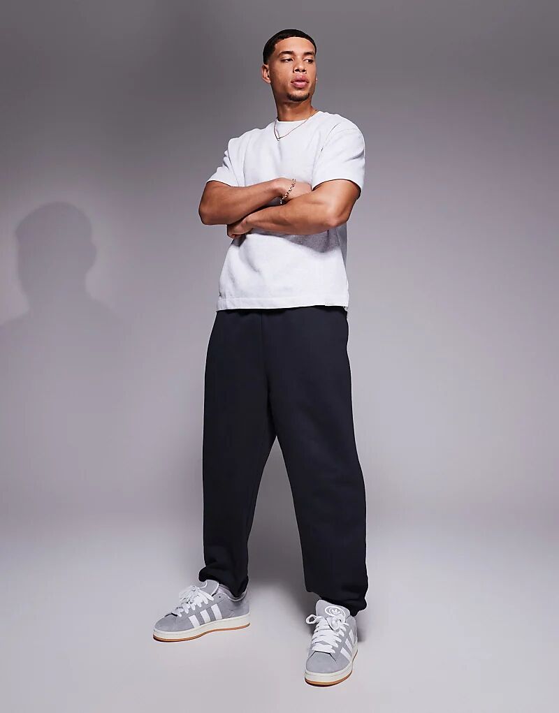 Премиальные плотные спортивные брюки свободного кроя ASOS DESIGN плотностью 400 г/м², цвет «уголь»
Премиальные плотные спортивные брюки свободного кроя ASOS DESIGN плотностью 400 г/м², цвет «уголь»