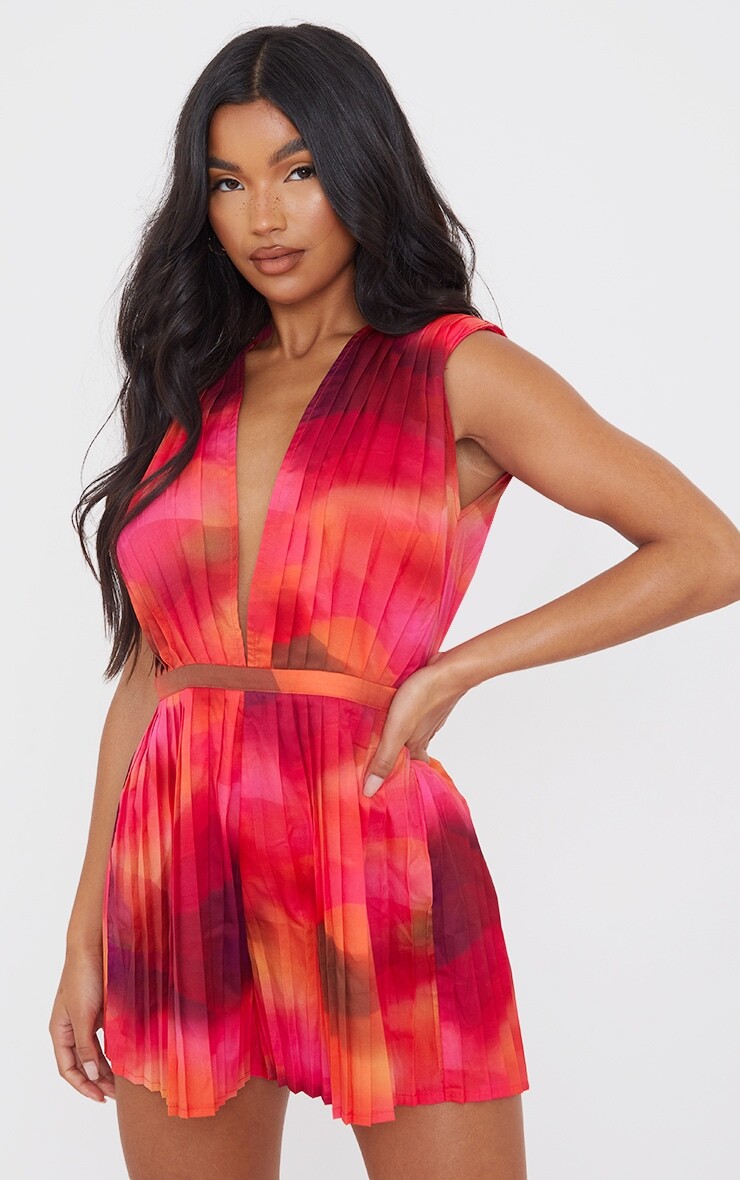 PrettyLittleThing Розовый комбинезон с глубоким вырезом и плиссированной накладкой на плечи с принтом «Волны»
PrettyLittleThing Розовый комбинезон с глубоким вырезом и плиссированной накладкой на плечи с принтом «Волны»