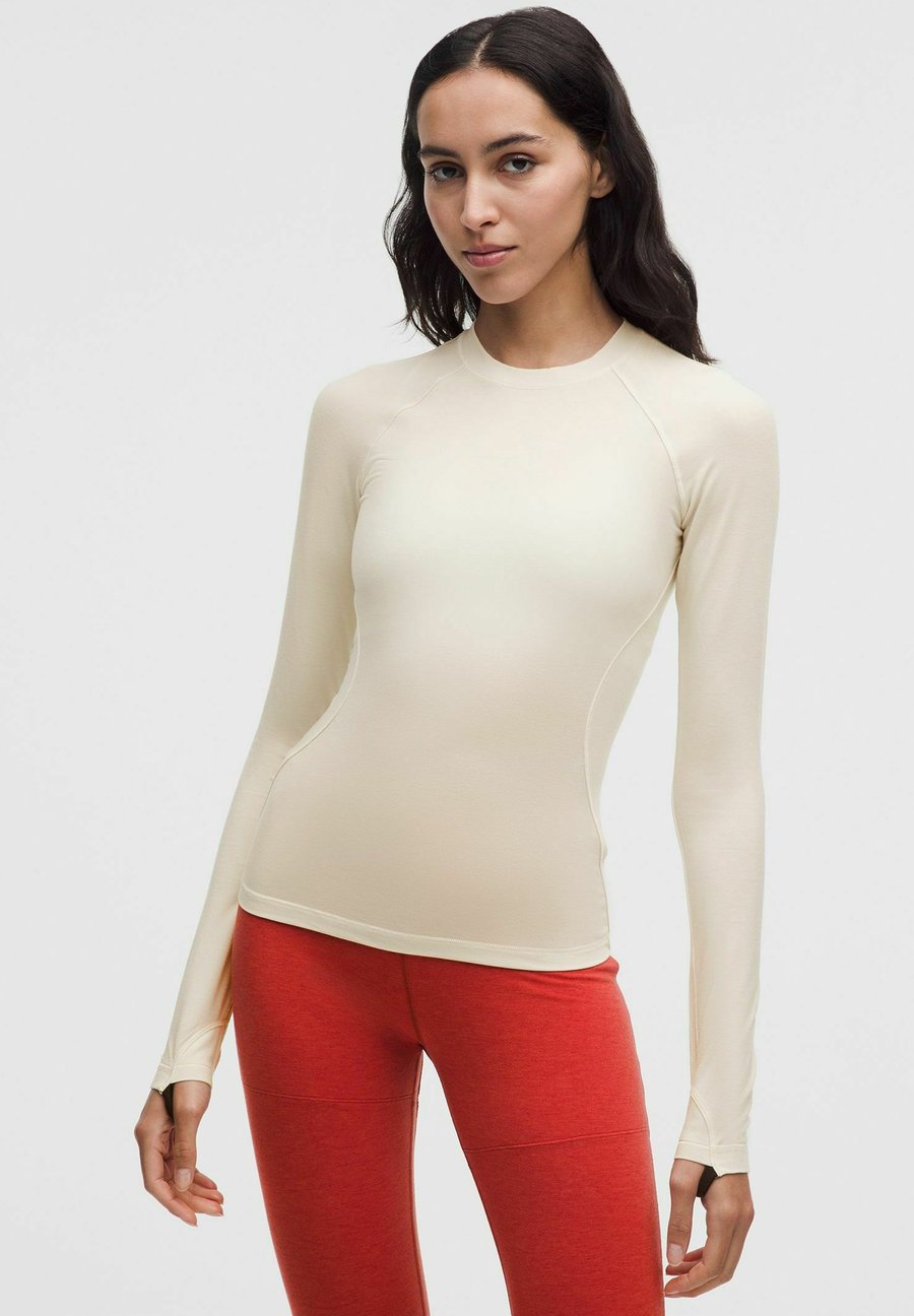 Топ lululemon Long sleeved top, Light Ivory Black/White
Топ lululemon Long sleeved top, Light Ivory Black/White