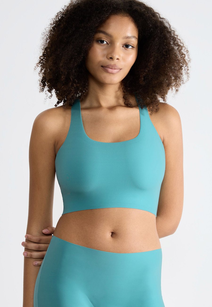 Бюстье Sloggi FEEL RACER, Quiet Turquoise/Turquoise
Бюстье Sloggi FEEL RACER, Quiet Turquoise/Turquoise