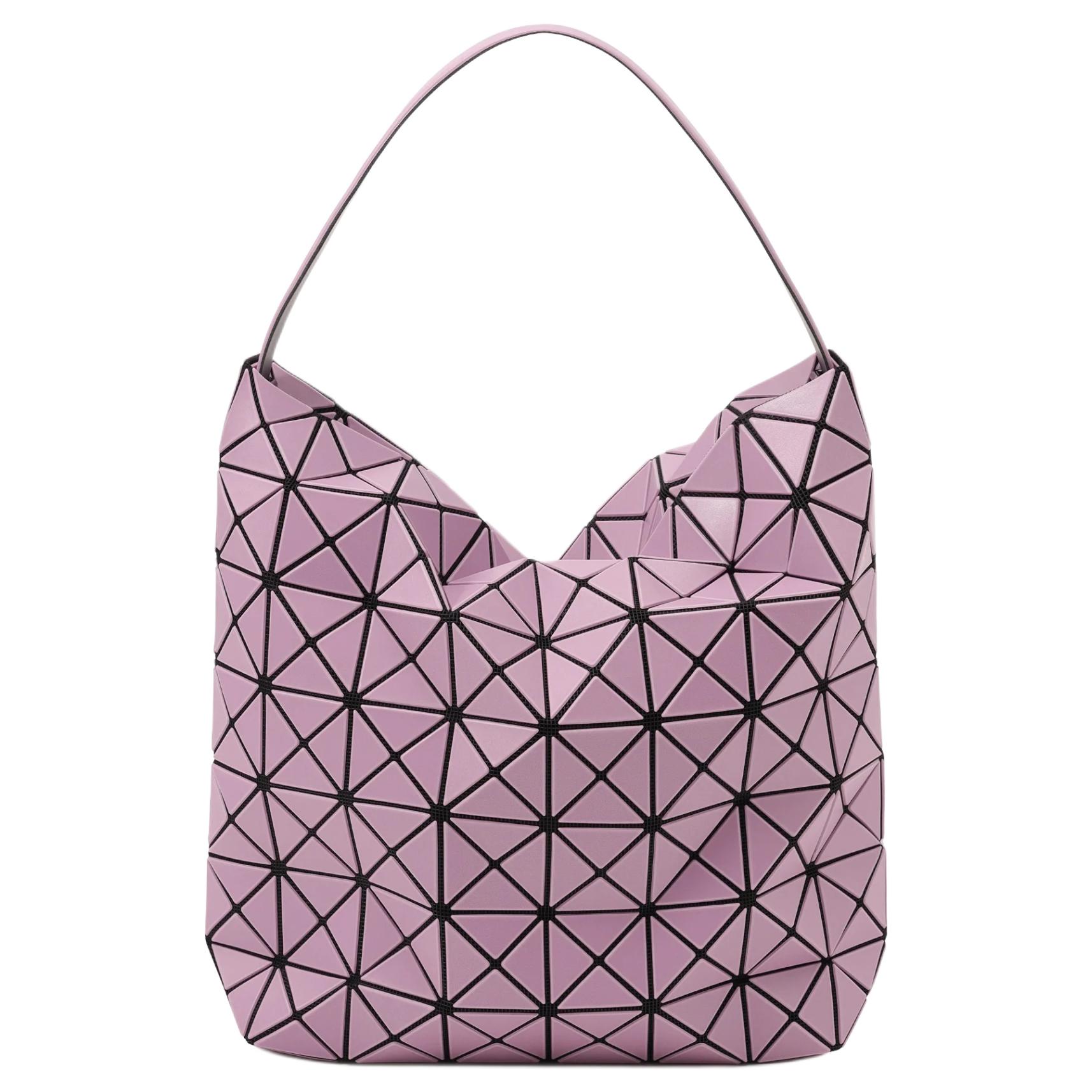 ISSEY MIYAKE Большая женская сумка из ПВХ розово-лавандового цвета
ISSEY MIYAKE Большая женская сумка из ПВХ розово-лавандового цвета