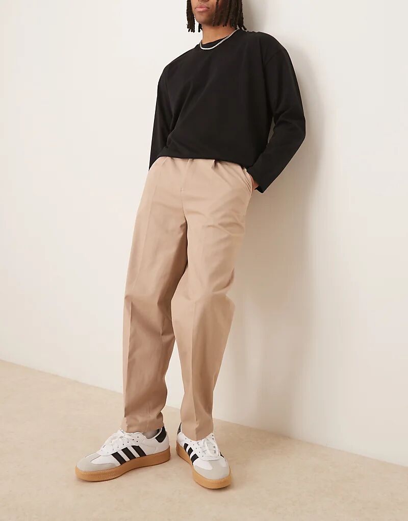 Строгие зауженные брюки-чиносы ASOS DESIGN из 100% хлопка свободного кроя с боковыми регуляторами цвета светло-бежевого камня 
Строгие зауженные брюки-чиносы ASOS DESIGN из 100% хлопка свободного кроя с боковыми регуляторами цвета светло-бежевого камня