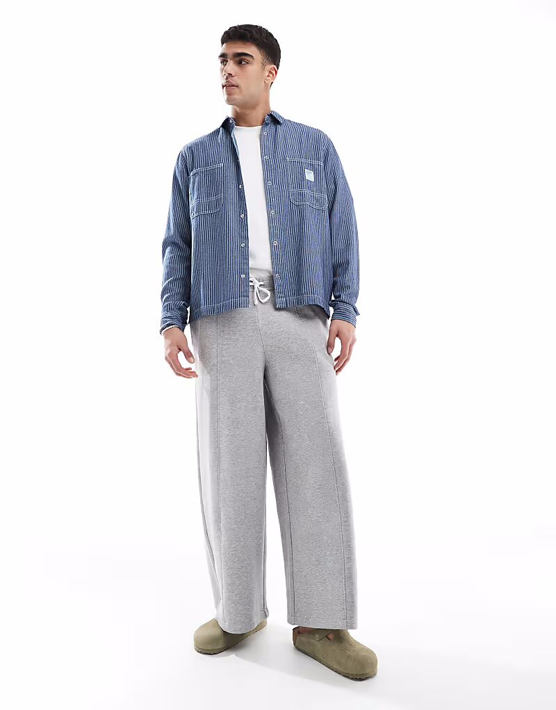 Широкие брюки-джоггеры ASOS DESIGN серого меланжевого цвета
Широкие брюки-джоггеры ASOS DESIGN серого меланжевого цвета