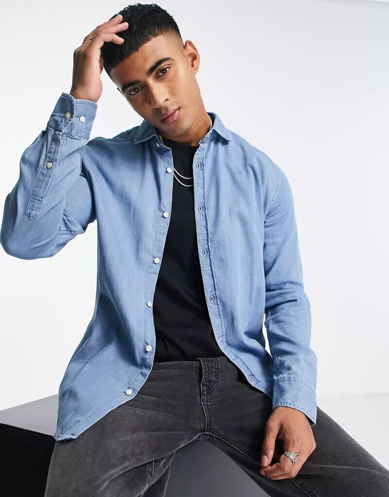 Синяя джинсовая рубашка Scalpers
Синяя джинсовая рубашка Scalpers