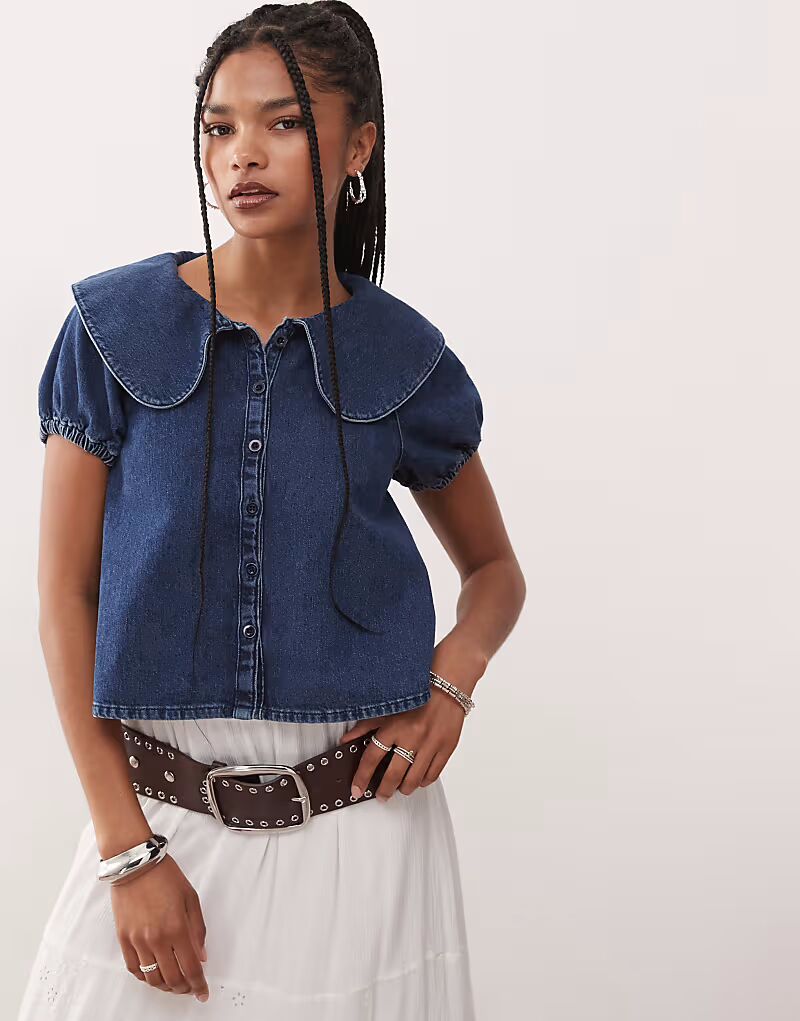 Восстановленная винтажная блузка с рукавами-фонариками и воротником Питер Пэн из денима Reclaimed Vintage
Восстановленная винтажная блузка с рукавами-фонариками и воротником Питер Пэн из денима Reclaimed Vintage