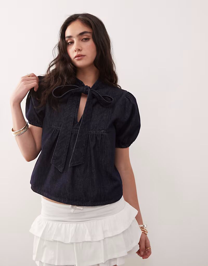 Джинсовый топ Reclaimed Vintage с рукавами-фонариками и завязкой на шее цвета светло-индиго
Джинсовый топ Reclaimed Vintage с рукавами-фонариками и завязкой на шее цвета светло-индиго