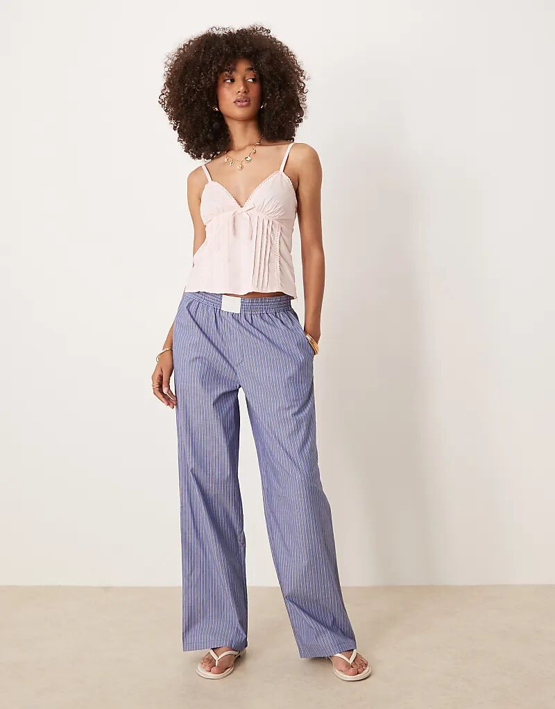 Брюки Lioness с широкими штанинами из поплина в синюю полоску
Брюки Lioness с широкими штанинами из поплина в синюю полоску