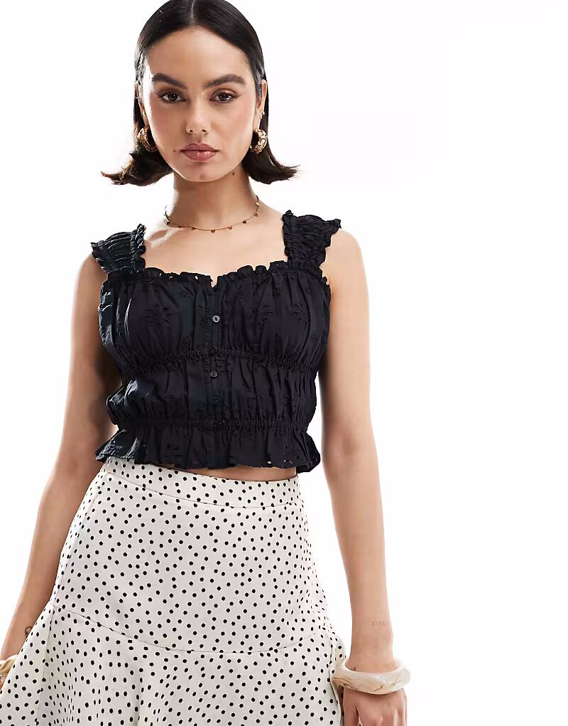 Укороченный топ Levi's Broderie черного цвета
Укороченный топ Levi's Broderie черного цвета