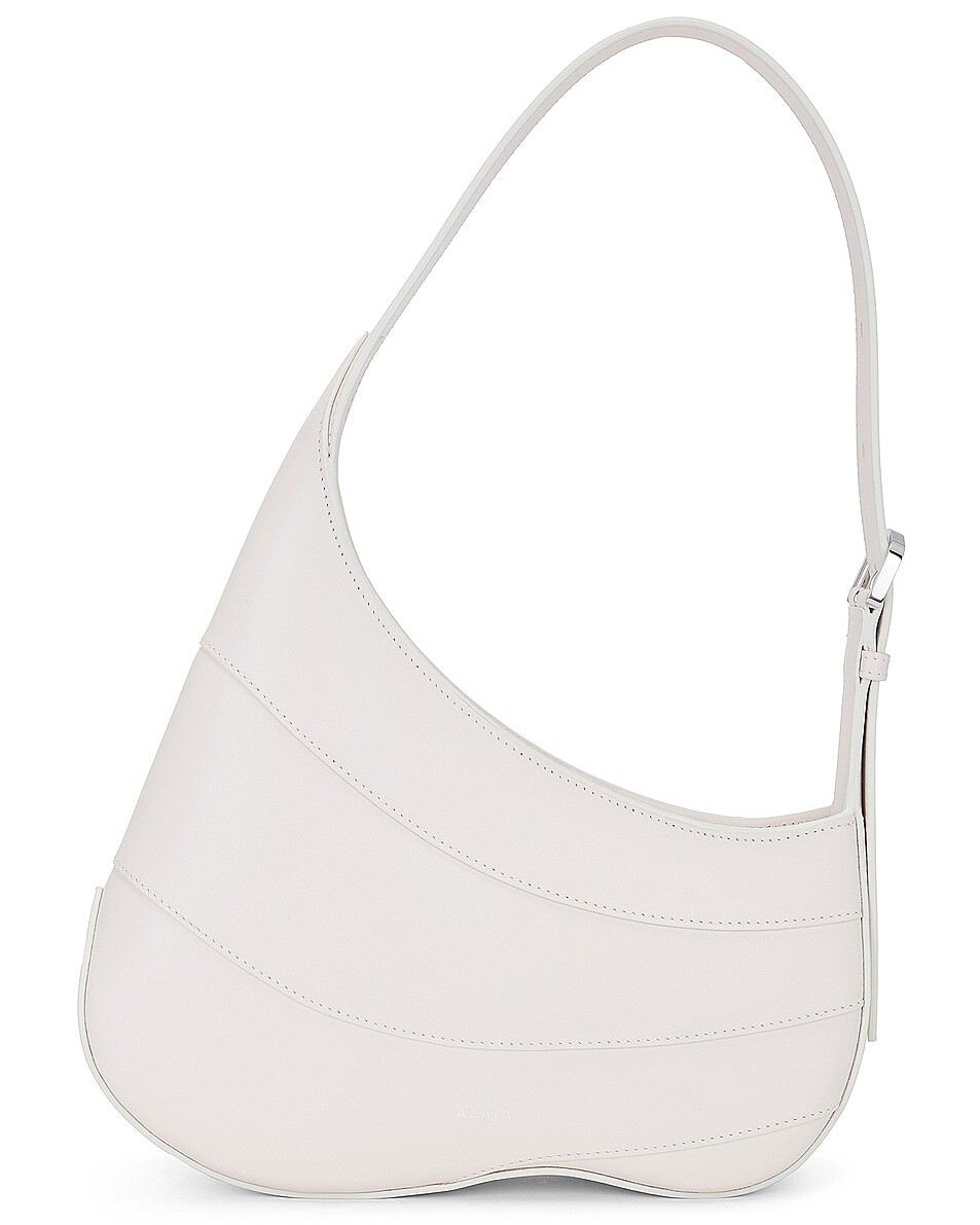 Сумка-хобо Djinn на молнии Alaïa, цвет Ivorie
Сумка-хобо Djinn на молнии Alaïa, цвет Ivorie