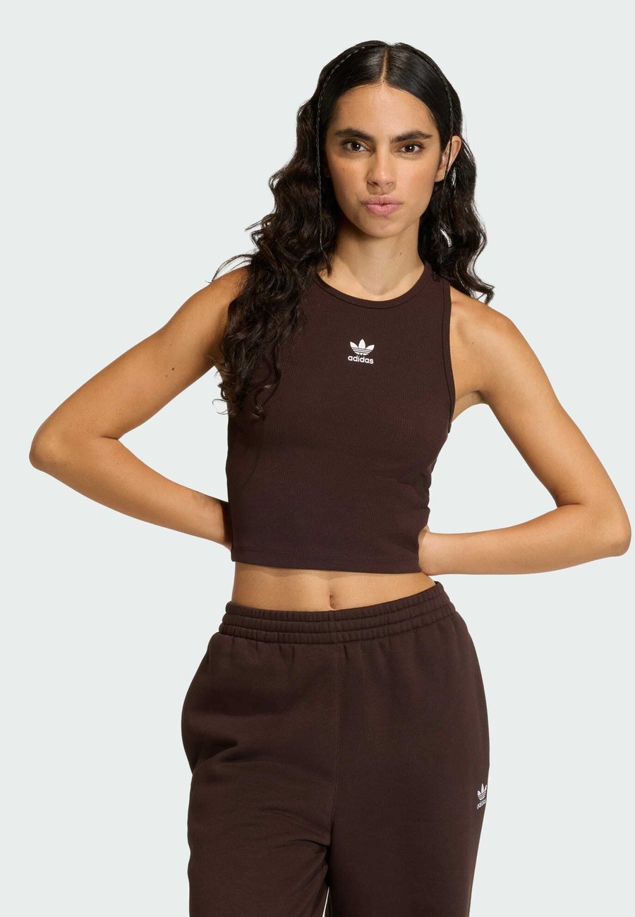 Топ Adidas Originals ESS TANK, Aurora Coffee/Dark Brown
Топ Adidas Originals ESS TANK, Aurora Coffee/Dark Brown